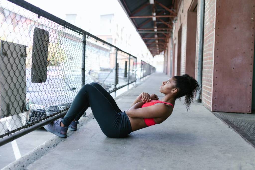 Woman doing sit up. Good exercise for being ski ready