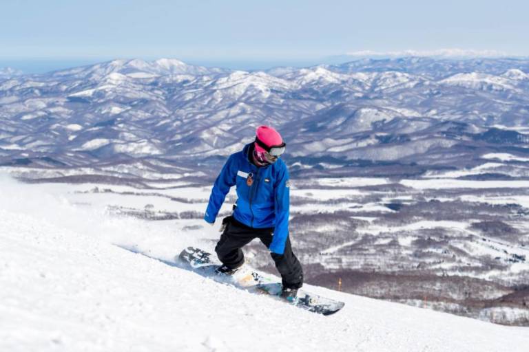 Snowboard instructor shows how to snowboard