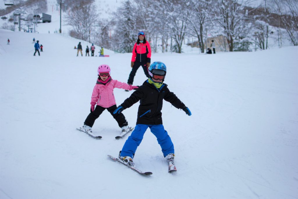 Children enjoying skiing and having fun