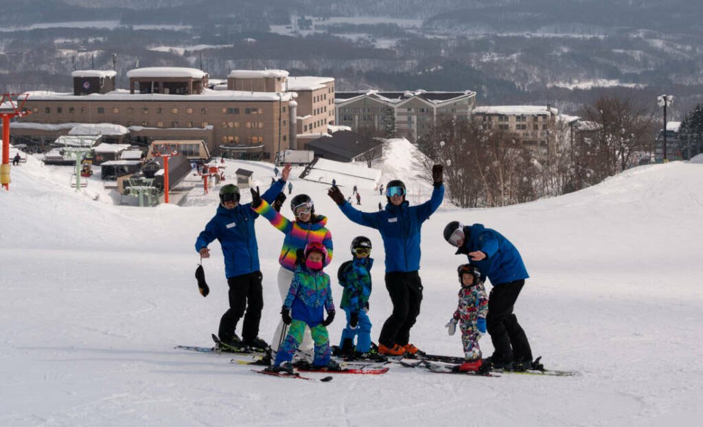 Ski instructors with family of mum and kids in Niseko