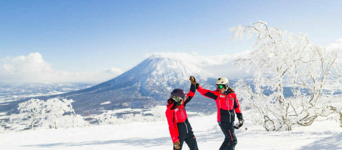 Skiers and snowboarders enjoying the stunning snow in Niseko